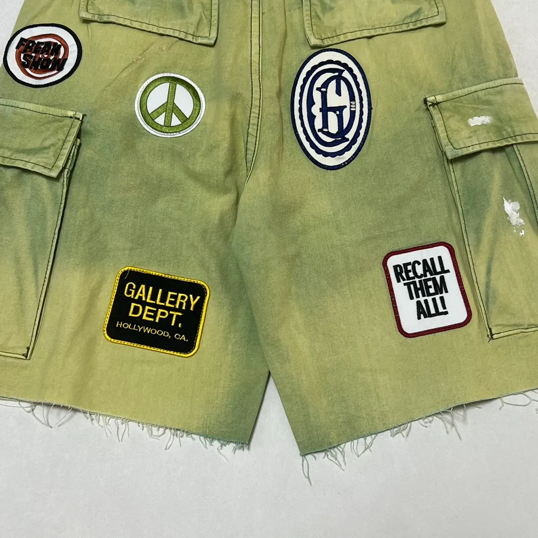 GALLERY DEPT. KENZIE FATIGUE CARGO SHORTS Patch embroidered shorts, distressed ink-splashed overalls, olive green size 30/32/34/36, heavy wash garment dyeing, jetted horse fade, washed and distressed products, each piece is slightly different, each piece is a work of art, Shimada machine embroidery, hand-splashed ink graffiti